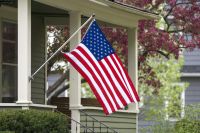 American flag hanging off a porch